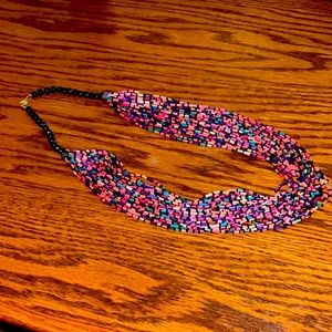 Multi colored beaded necklace and is 24 inches. Excellent condition!!